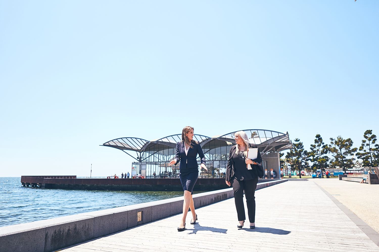 Selina Clark and Nicole Hoyle walking along Geelong waterfront